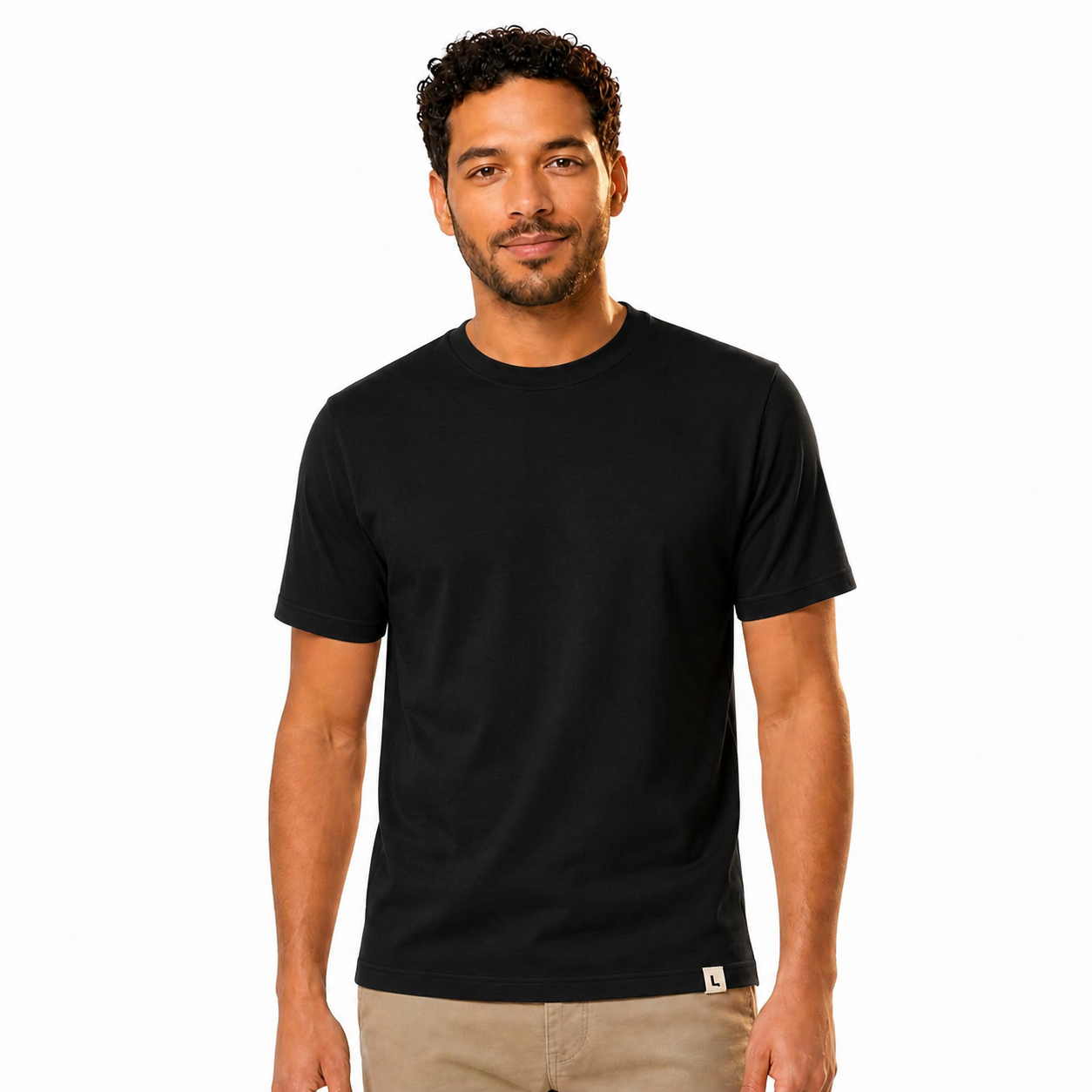 The Signature Tee in Black — worn by model