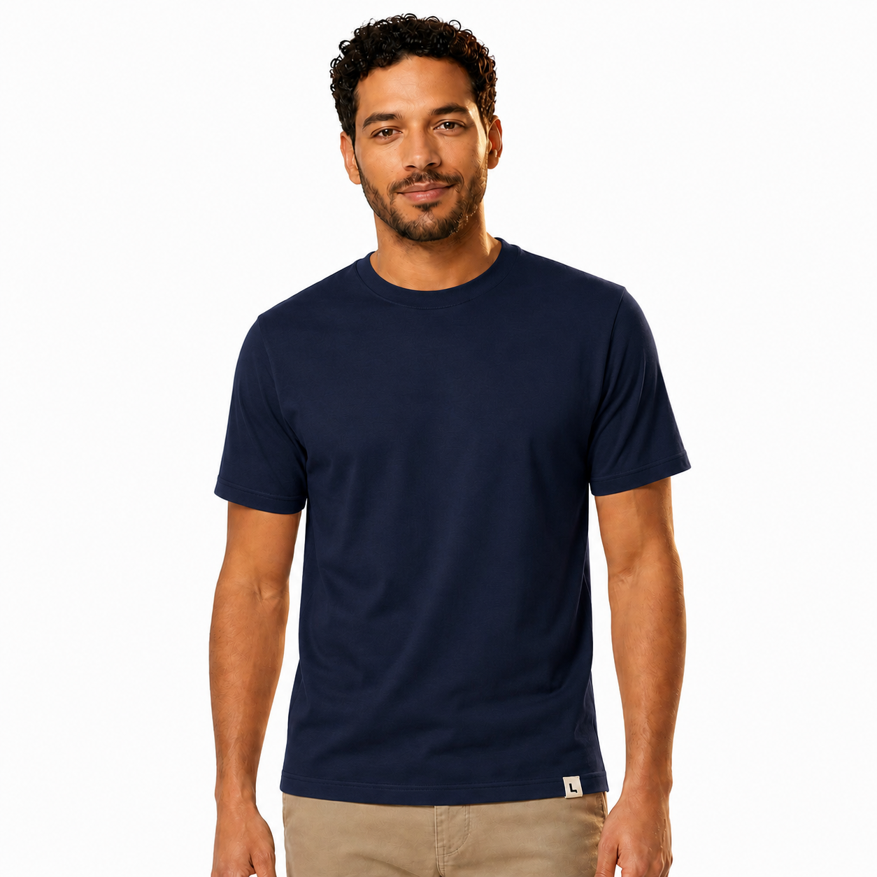 The Signature Tee in Navy Blue — worn by model