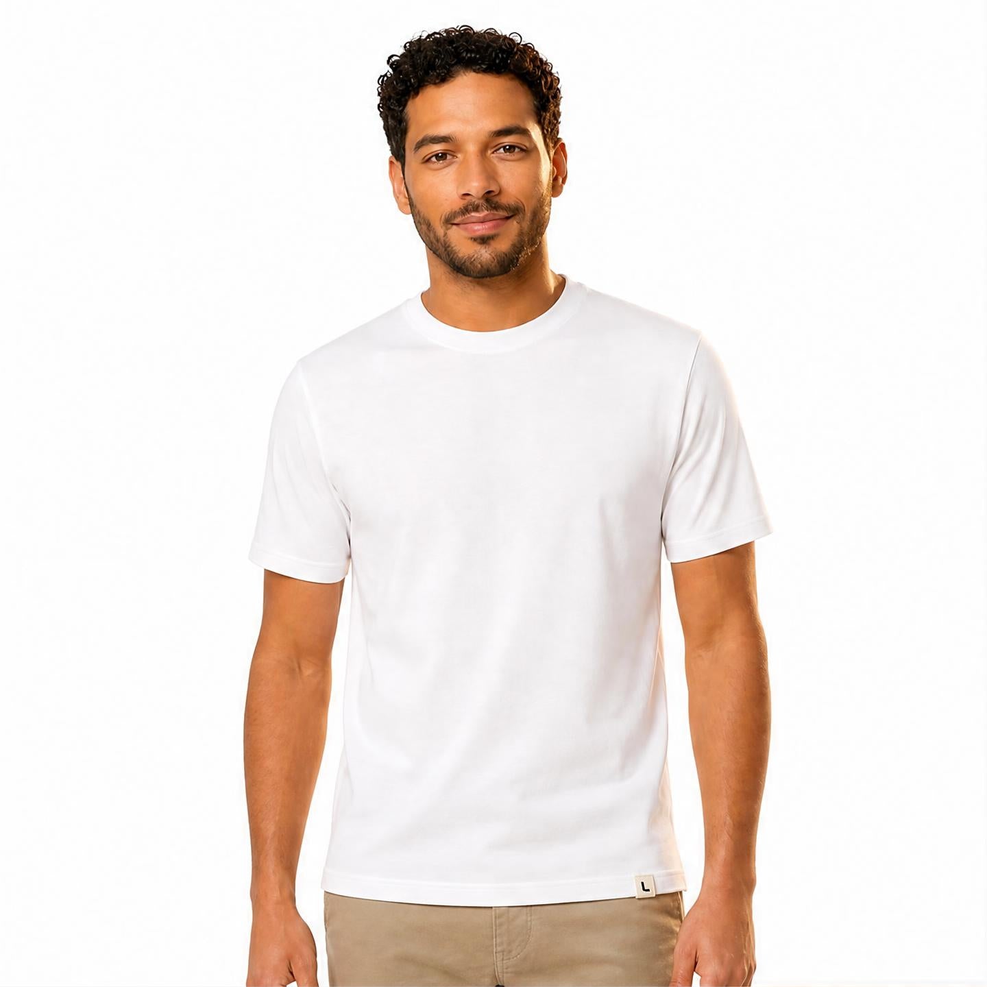 The Signature Tee in White — worn by model